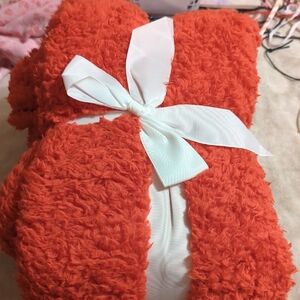 Cozy Orange Fuzzy Blanket with White Ribbon